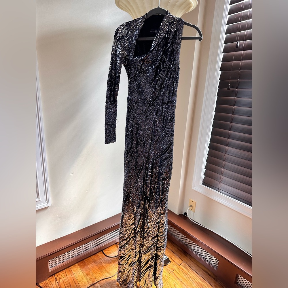 Prom gown, or wedding guest gown. Worn once size 2 fit like a zero.